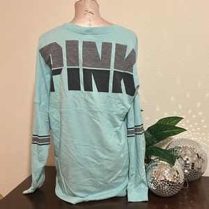 Pink sweatshirt pullover with logo on back and pink dog on front